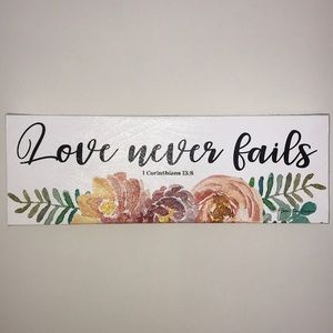 Love never fails canvas wall print